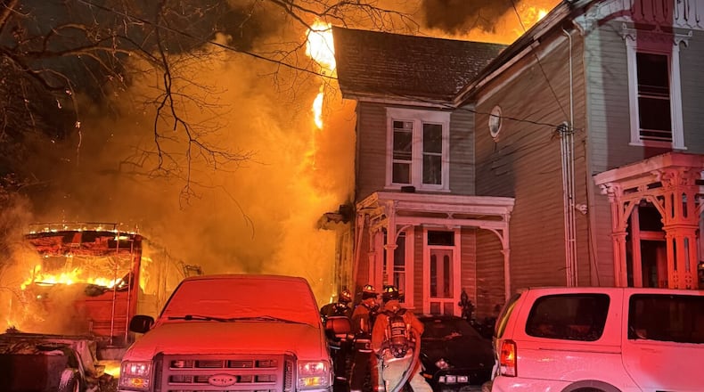A fire consumed a building in Hartwell (Cincinnati) on Saturday night that firefighters believe grew quickly after a camper fire set off propane tanks. CINCINNATI FIRE DEPARTMENT/CONTRIBUTED
