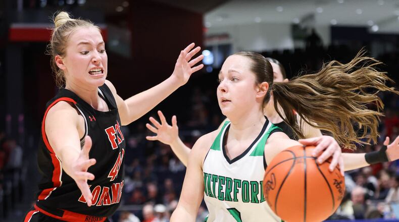Fort Loramie senior forward Avery Brandewie guards Waterford's Elsie Malec during the Division VII state final on Saturday at University of Dayton Arena. Brandewie was named the Div. VII player of the year, and Fort Loramie coach Carla Siegel was named coach of the year. The Redskins finished as D-VII runner-up after losing to Waterford; the squad won the D-IV title last year. Brandewie was also a first team all-Ohio selection in Div. VII volleyball. BRYANT BILLING / STAFF