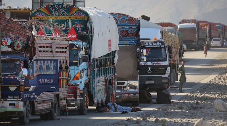 A line of cargo trucks bound for Pakistan is stranded on the Afghan side of the Torkham border crossing, which remained closed after clashes, in Nangarhar province, Afghanistan, Tuesday, Oct. 14, 2025. (AP Photo/Wahidullah Kakar)