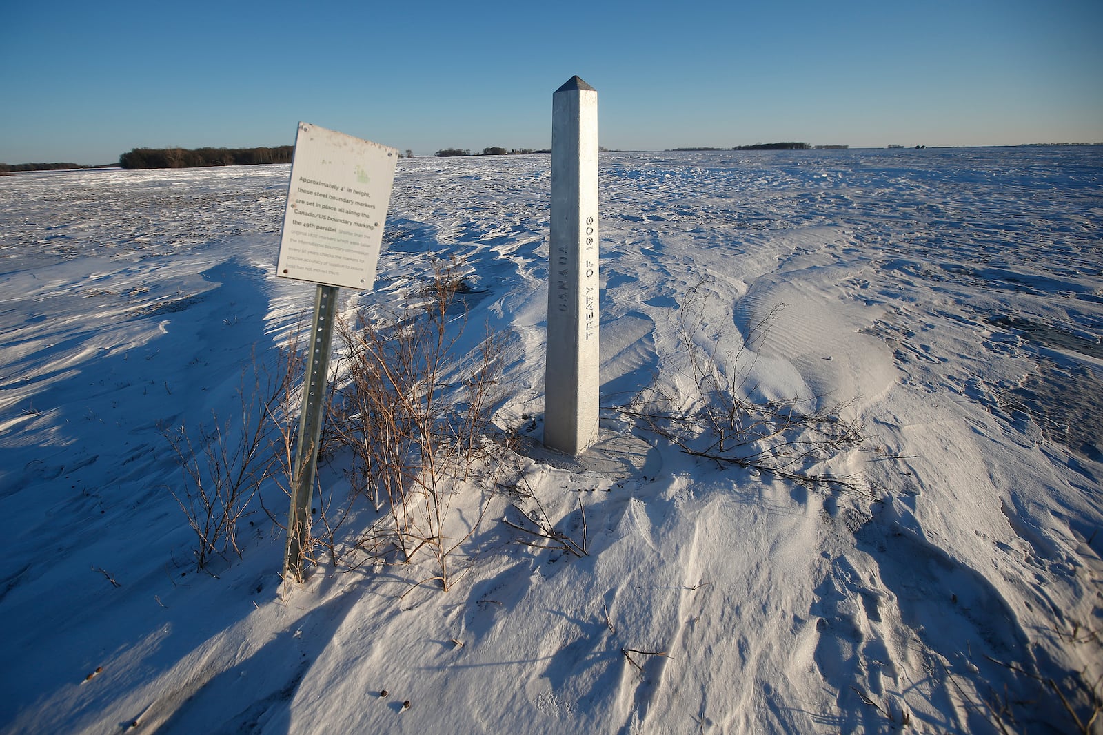FILE - A border marker, between the United States and Canada is shown just outside of Emerson, Manitoba, on Thursday, Jan. 20, 2022. (John Woods/The Canadian Press via AP, File)