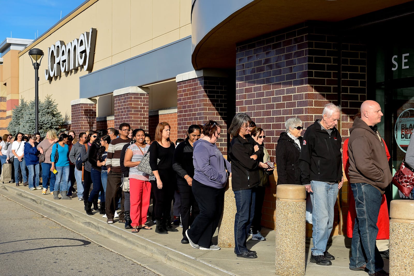 Shoppers wait in line outside the JC Penny store at Bridgewater Falls to take advantage of the Black Friday sales on Thanksgiving Day in November 2024. NICK GRAHAM/STAFF
