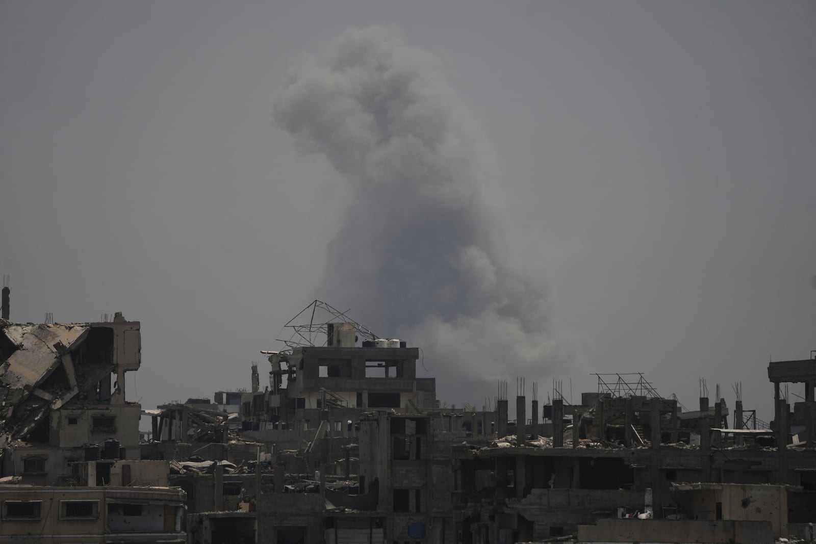 Smoke rises following an Israeli airstrike in northern Gaza Strip, Tuesday, July 29, 2025. (AP Photo/Jehad Alshrafi)