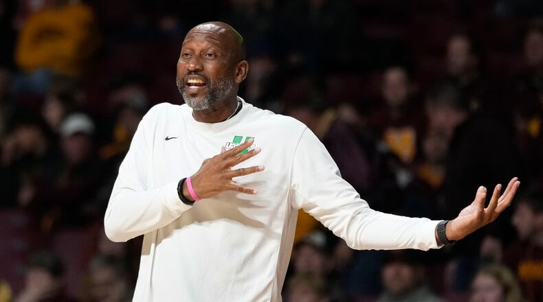 USC Upstate head coach Dave Dickerson gestures toward a referee during the first half of an NCAA college basketball game against Minnesota, Saturday, Nov. 18, 2023, in Minneapolis. (AP Photo/Abbie Parr)