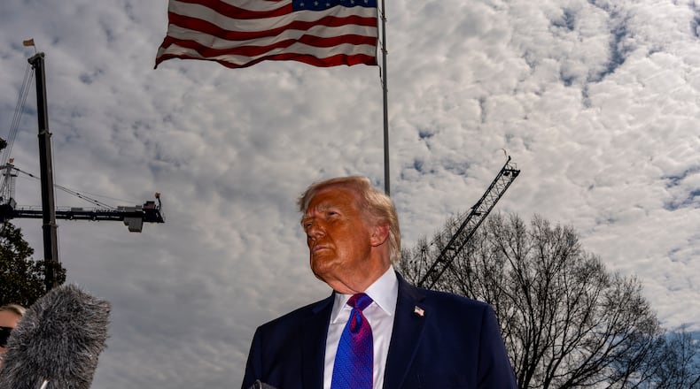 President Donald Trump speaks with reporters before departing on Marine One from the South Lawn of the White House, Wednesday, March 11, 2026, in Washington. (AP Photo/Alex Brandon)