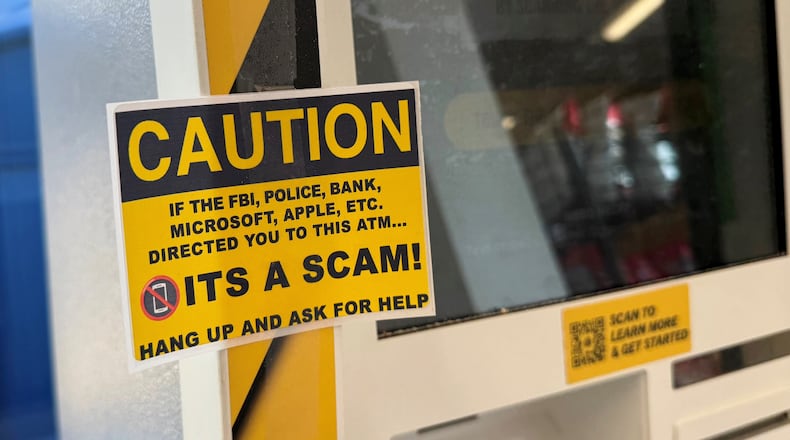 Bitcoin and cryptocurrency scams use ATMs like this yellow one in a Circle K convenience store in on Ohio 4 in Fairfield, which warns potential users of scams. Bad actors are utilizing these types of machines in scams that defrauds people out of hundreds and even thousands of dollars. MICHAEL D. PITMAN/STAFF