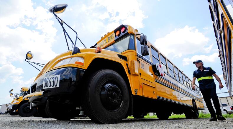 FILE PHOTO: Mechanic Tim Audia checks location of numbers on a new bus from 3019 before putting numbers on one of the five new buses they got for the 2020 year at the Petermann bus depot in Middletown. Staff photo by Nick Graham