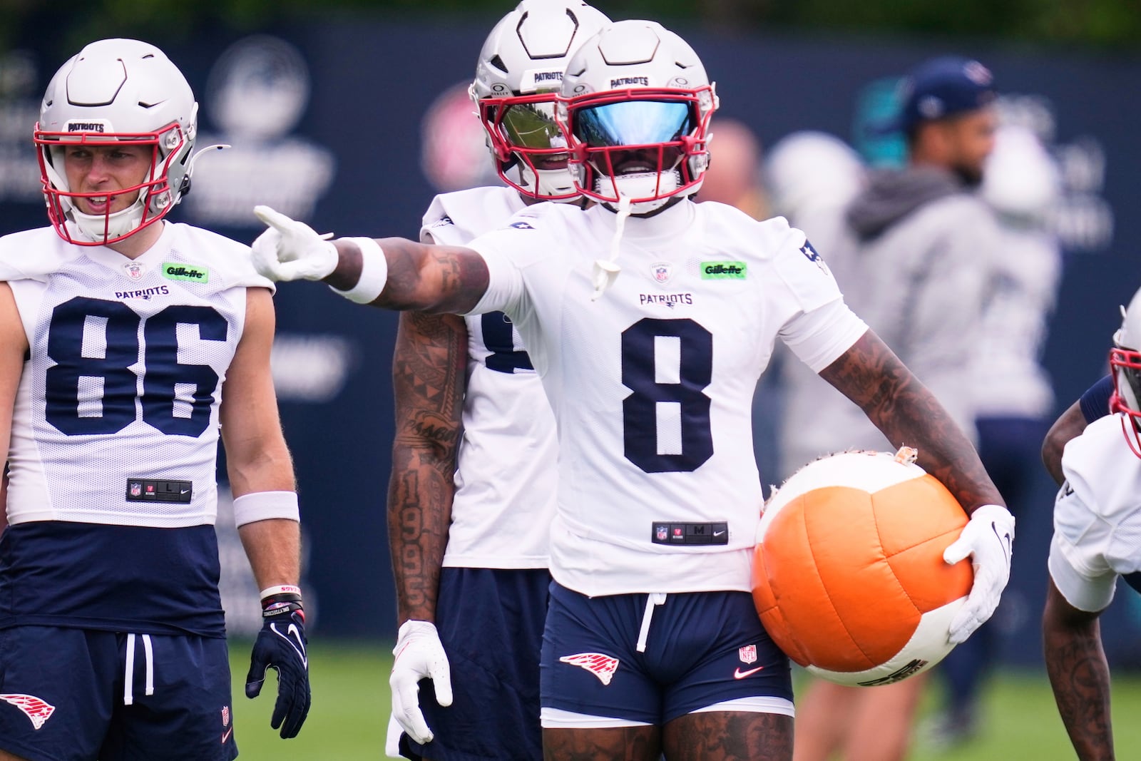 New England Patriots wide receiver Stefon Diggs prepares to run a drill with a heavy ball during an NFL football practice, Monday, June 9, 2025, in Foxborough, Mass. (AP Photo/Charles Krupa)