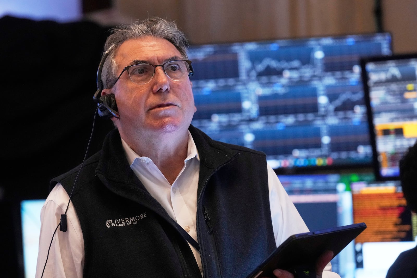 Trader John Bishop works on the floor of the New York Stock Exchange, Thursday, May 1, 2025. (AP Photo/Richard Drew)