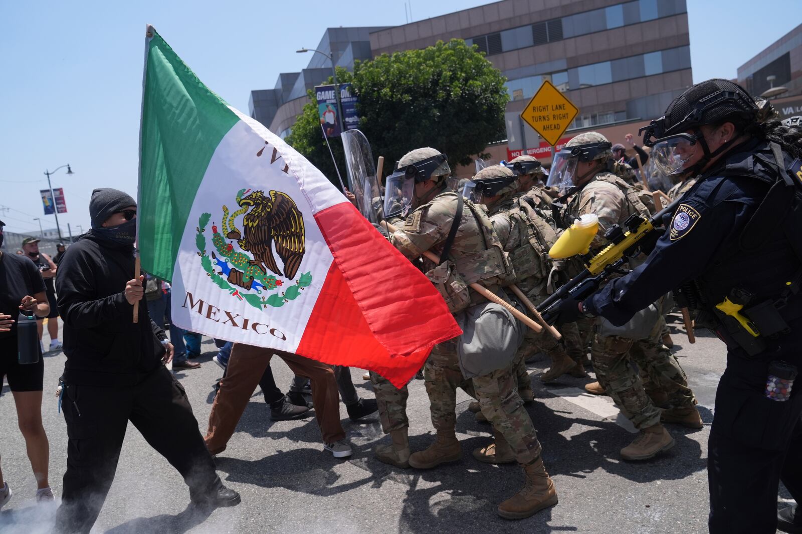 FILE - Protesters clash with authorities in downtown Los Angeles, Sunday, June 8, 2025, following last night's immigration raid protest. (AP Photo/Jae Hong, File)