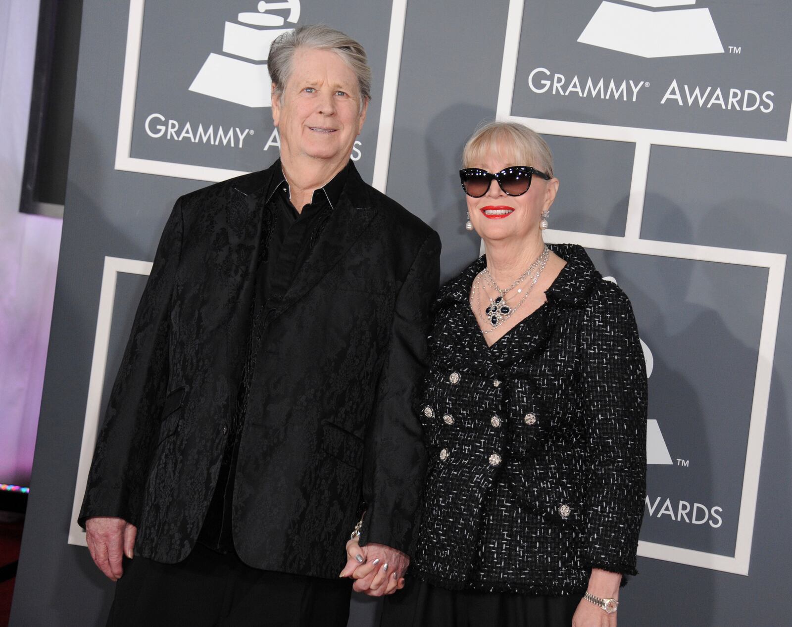 FILE - Musician Brian Wilson, left, and his wife Melinda Ledbetter Wilson arrive at the 55th annual Grammy Awards on Sunday, Feb. 10, 2013, in Los Angeles. (Photo by Jordan Strauss/Invision/AP, File)