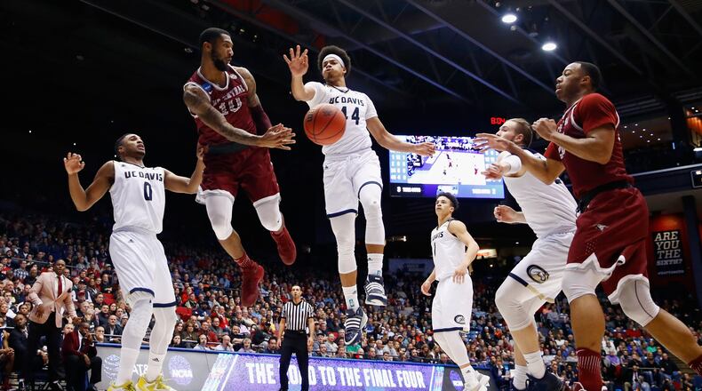Dajuan Graf (No. 10) of North Carolina Central passes against Garrison Goode of UC Davis in the second half during their First Four game at UD Arena on Wednesday. Getty Images