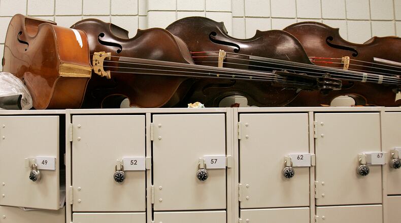 Musical instruments, forgotten amid the clutter of dark closets for decades, can find new life as part of the Oxford Community Band. (STAFF FILE PHOTO)