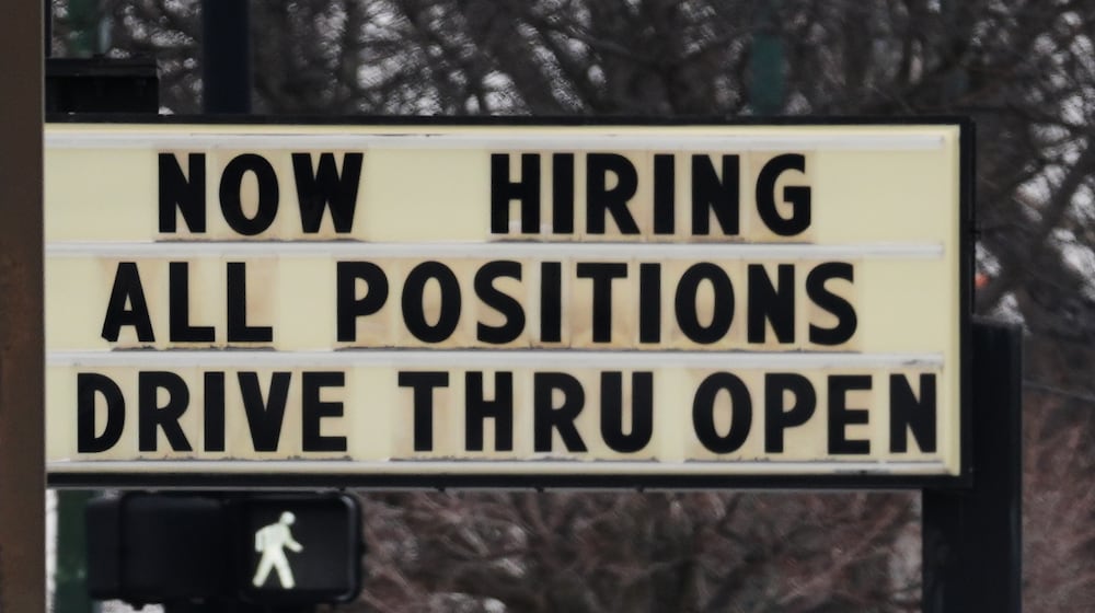 Hiring sign is displayed in front of a restaurant in Chicago, Thursday, Feb. 5, 2026. (AP Photo/Nam Y. Huh)
