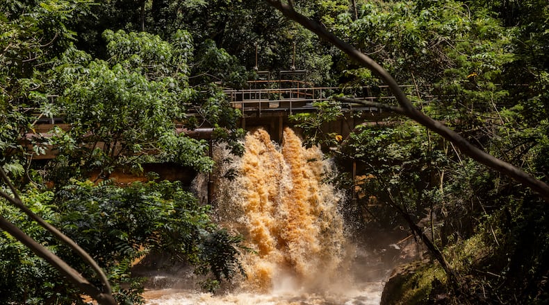 Water from the Wahiawa Dam flows into the Kaukonahua stream in Wahiawa, Hawaii, on Tuesday, March 24, 2026, after recent storms. (Stephen Lam/San Francisco Chronicle via AP)