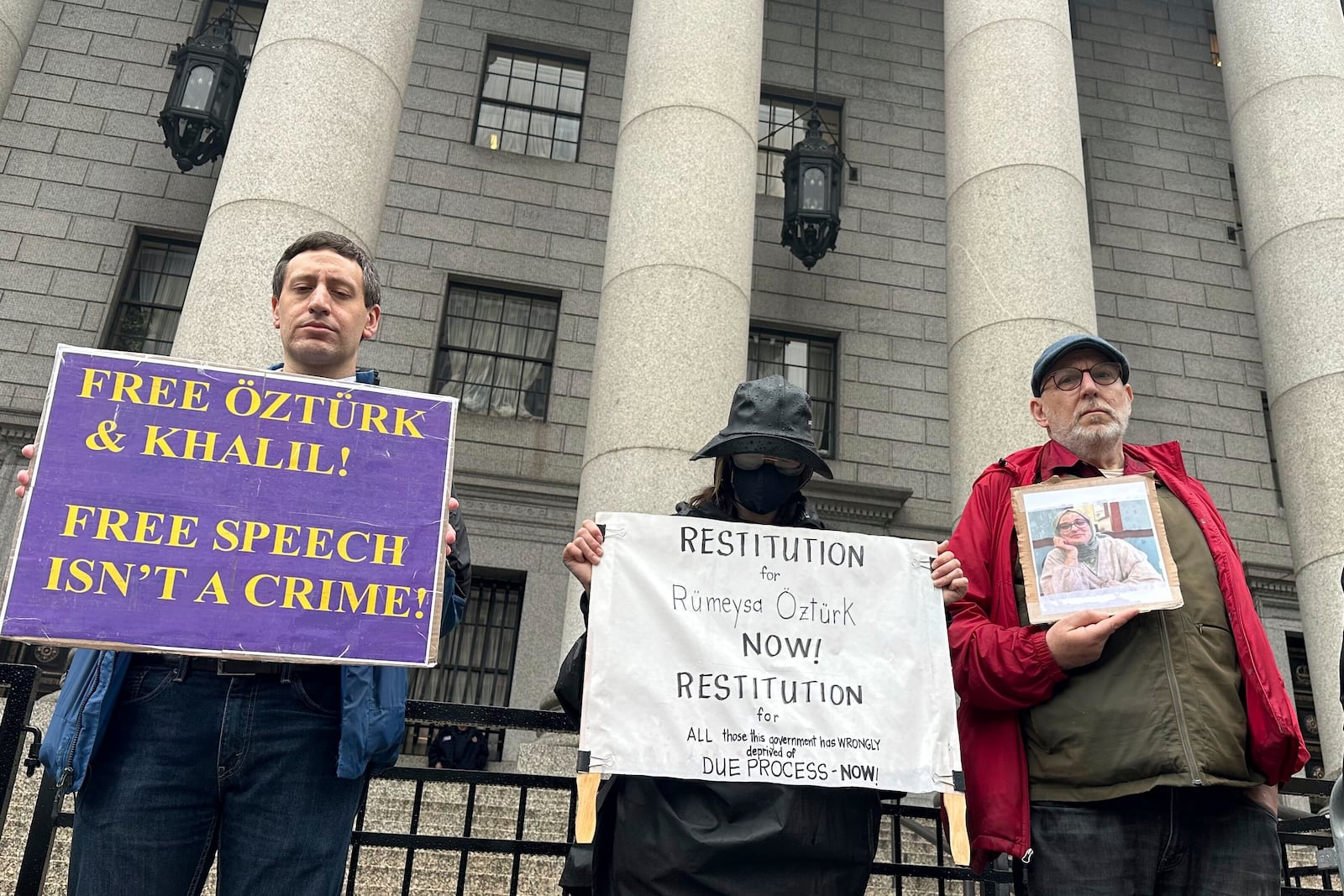 Protesters hold up signs outside court as a federal appeals court is scheduled to hear arguments in the cases of a Turkish Tufts University student who has been detained by immigration authorities for six weeks and a Palestinian student at Columbia University who was recently released from detention on Tuesday, May 6, 2025 in New York. (AP Photo/David Martin)