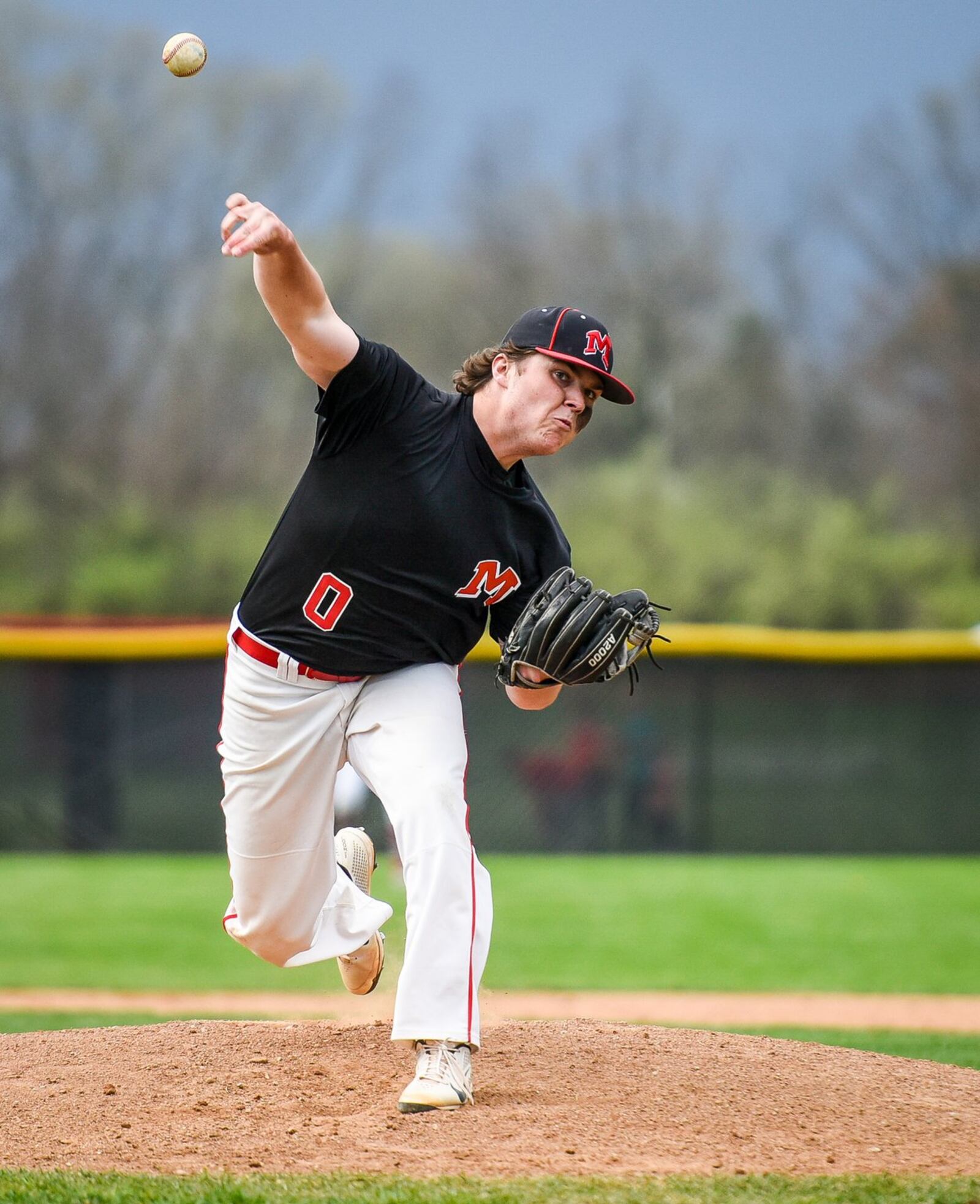 Madison’s Reid Davis throws a pitch during Wednesday’s suspended game against host Carlisle at Sam Franks Field. NICK GRAHAM/STAFF