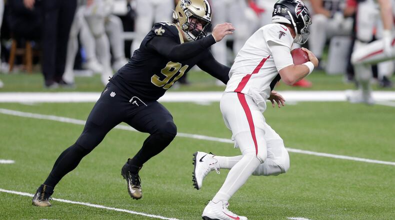 File-This Nov. 22, 2020, file photo shows New Orleans Saints defensive end Trey Hendrickson (91) sacking Atlanta Falcons quarterback Matt Ryan (2) in the first half of an NFL football game in New Orleans. After free agent Carl Lawson signed with the Jets, the Bengals hoped to bolster their pass rush by picking up Hendrickson, an edge rusher who logged 13.5 sacks with the Saints last year. (AP Photo/Brett Duke, File)