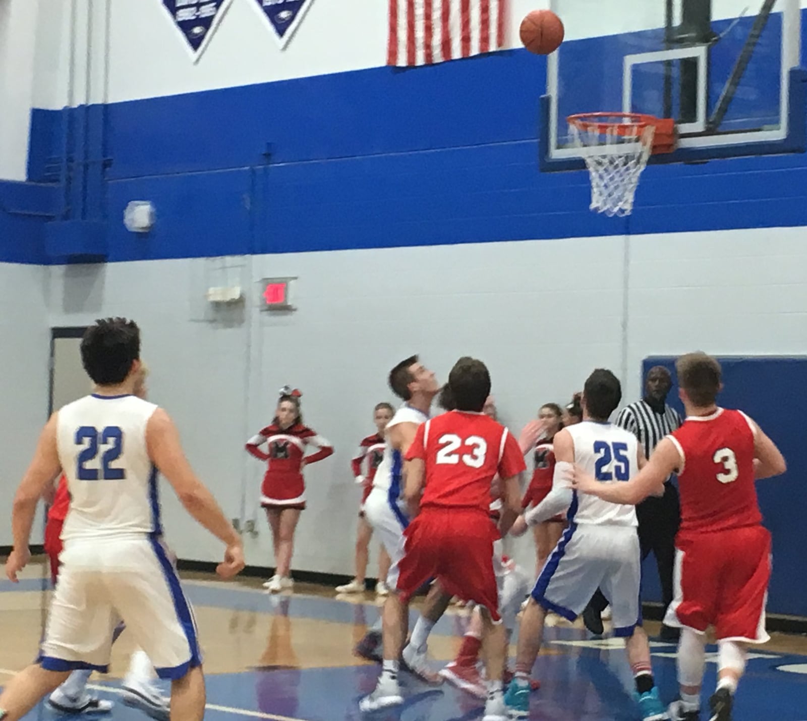 Madison’s Jake Munafo (23) and Mason Whiteman (3), along with Middletown Christian’s Jonah Crawford (25), are among the players waiting to get a rebound Tuesday night at MCS. RICK CASSANO/STAFF