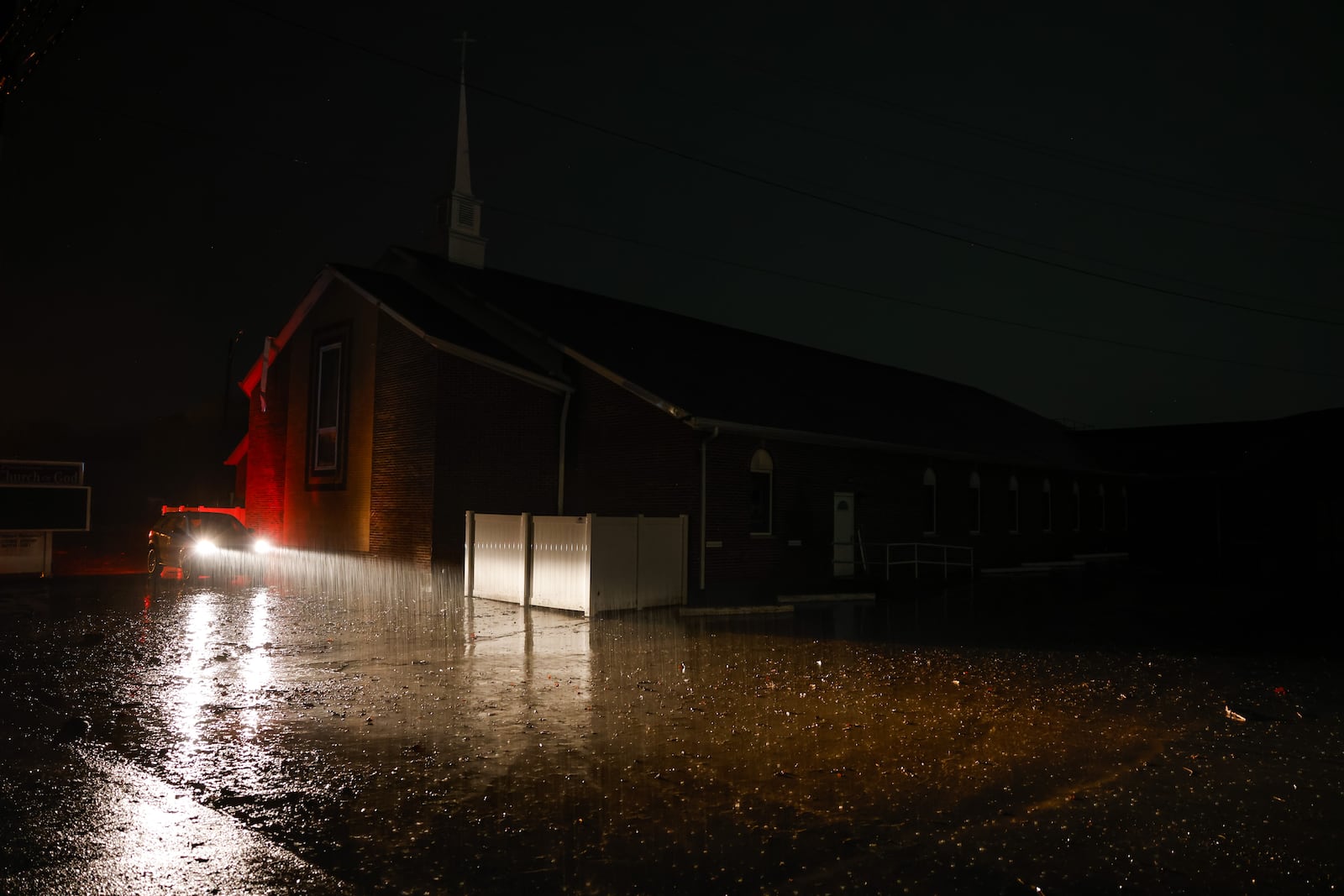 The parking lot at Poasttown First Church of God is flooded on Germantown Road early Thursday morning, March 5, 2026 in Madison Township in Butler County. Heavy rain caused flooding in many areas. NICK GRAHAM/STAFF