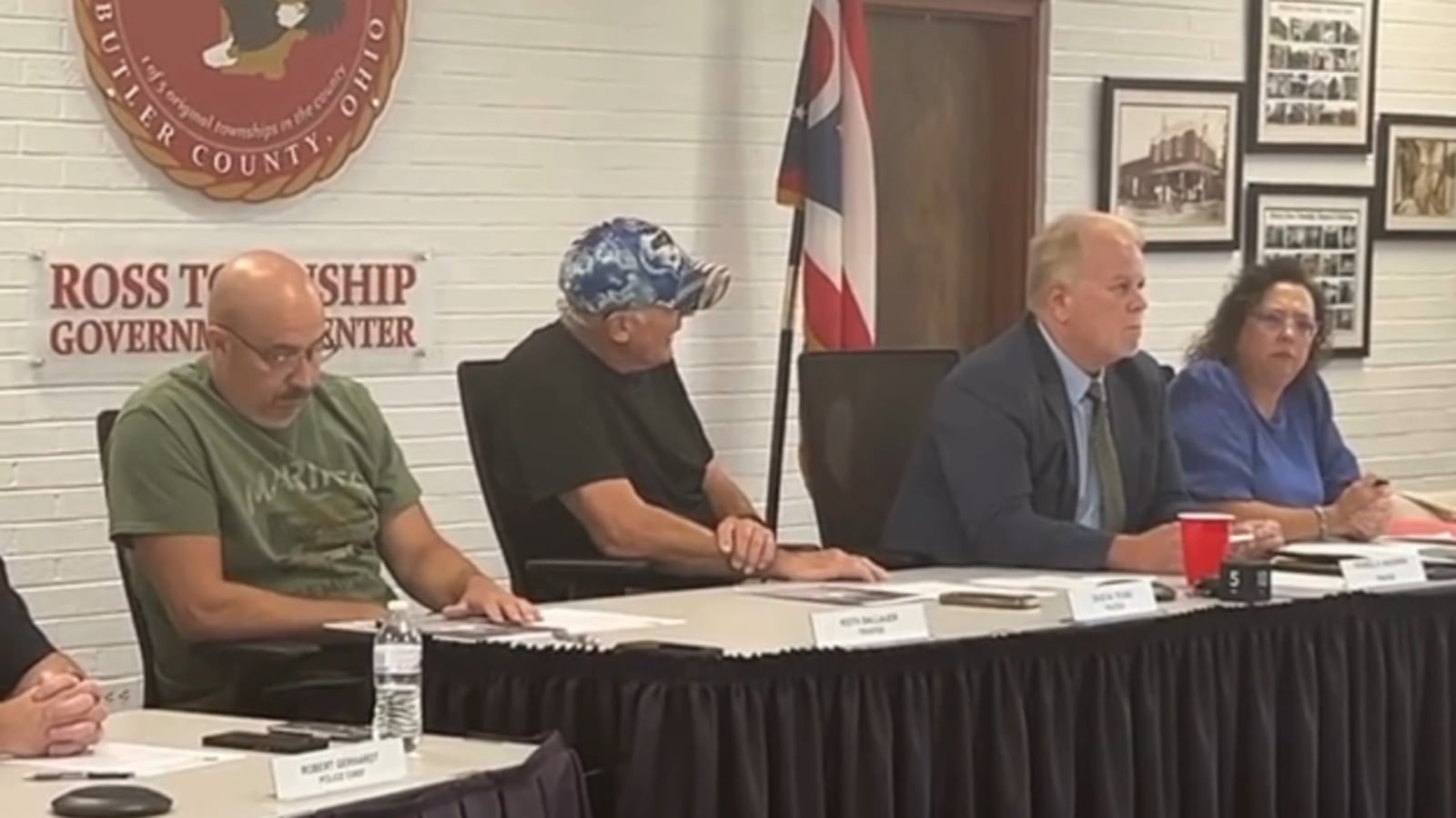 Charles Young, center in hat, has been asked to resign as a Ross Twp. trustee after he posted racist remarks on his social media account. WCPO photo