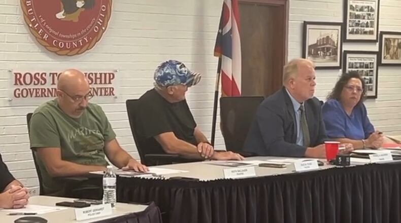 Dvid Young, center in hat, has been asked to resign as a Ross Twp. trustee after he posted racist remarks on his social media account. WCPO photo