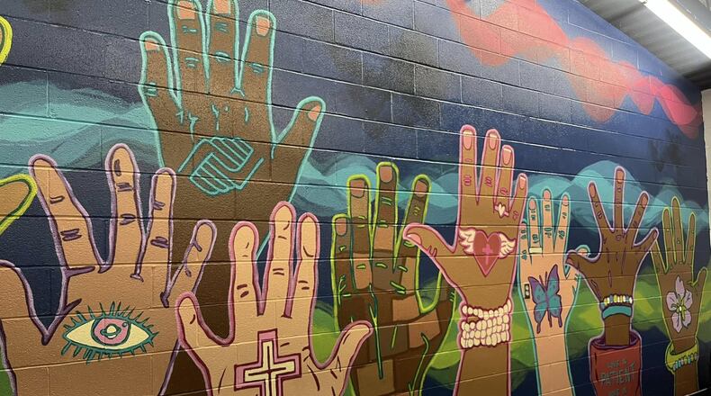 Artists with developmental disabilities and staff from InsideOut Studio in Hamilton, recently collaborated with teenagers from the Boys & Girls Club of Hamilton at the Grand Boulevard location to create a vibrant installation mural for their Teen Center.