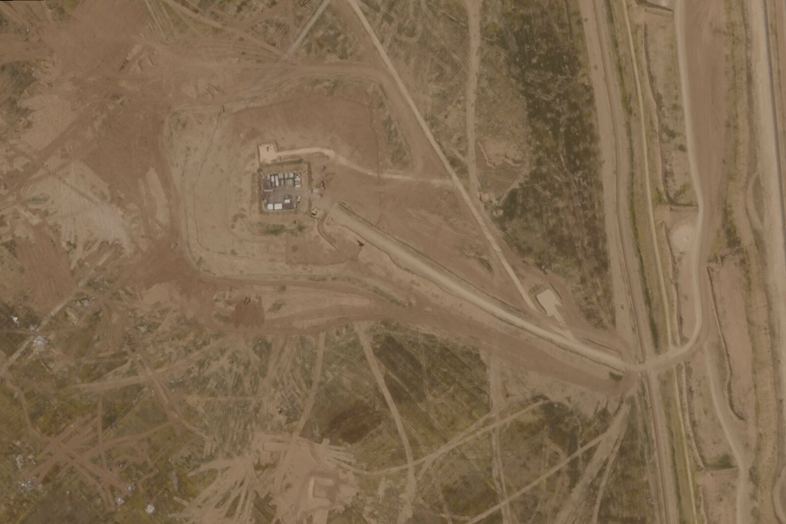 This satellite photo from Planet Labs PBC shows In Israeli Defense Forces outpost near the town of Khuzaa, east of Khan Younis in the southern Gaza Strip in March, 2025. (Planet Labs PBC via AP)