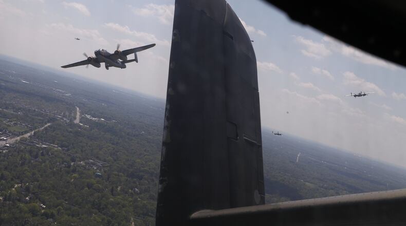 B-25s fly in formation over a National Museum of the U.S. Air Force memorial service Wednesday, April 18, 2012 on the 70th anniversary of the Doolittle Raid on Tokyo.