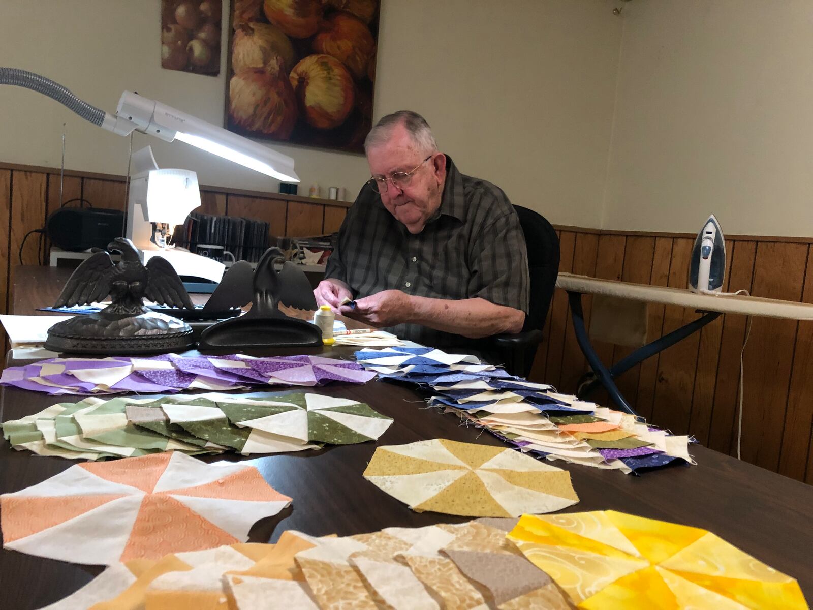 Orville ???, a retired preacher, estimates he has made 150 quilts since he started in 2001 after he was diagnosed with cancer. RICK McCRABB/STAFF