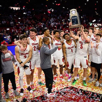 The Miami University men's basketball team hoists the Mid-American Conference trophy after beating Toledo 74-72 on Tuesday, March 3, 2026 at Millett Hall. JEREMY MILLER / CONTRIBUTED PHOTO
