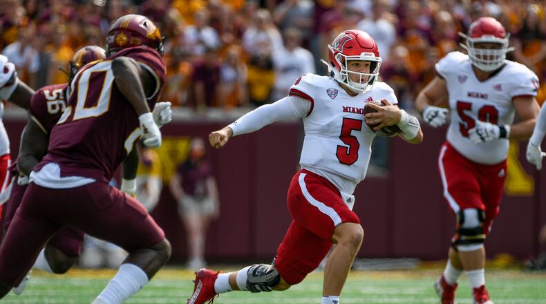 Miami-Ohio quarterback Brett Gabbert (5) runs for a short gain against Minnesota during the first half of an NCAA college football game on Saturday, Sept. 11, 2021, in Minneapolis. Minnesota won 31-26. (AP Photo/Craig Lassig)