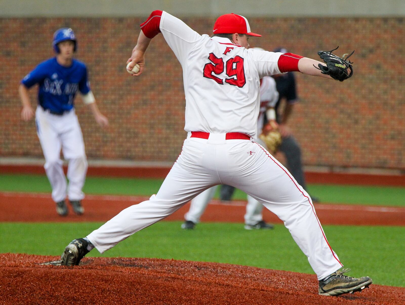 Fairfield pitcher Tyler Morgan (29) throws to the plate during a Division I regional semifinal against St. Xavier at the University of Cincinnati’s Marge Schott Stadium. GREG LYNCH/STAFF