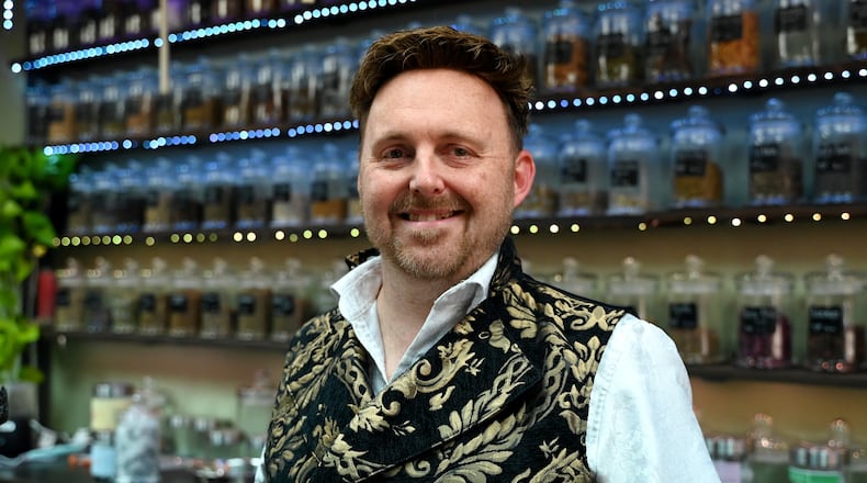 Isaac Reed opened his store, Arius and Phos, opened at 229 Main St. in Hamilton's urban core. MICHAEL D. PITMAN/STAFF