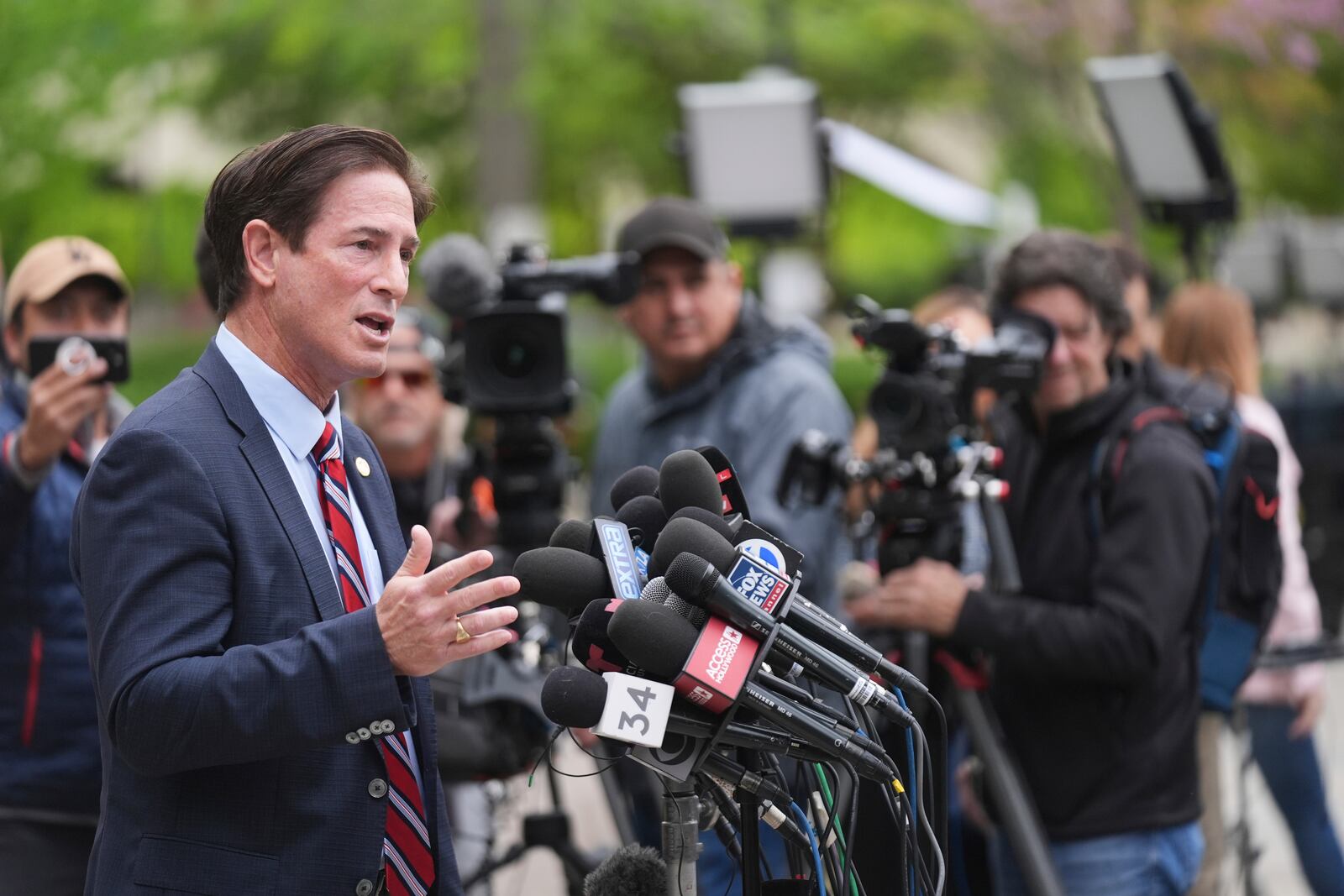 Los Angeles County District Attorney Nathan Hochman speaks outside of court before a hearing in the case of Erik and Lyle Menendez Thursday, April 17, 2025, in Los Angeles. (AP Photo/Damian Dovarganes)
