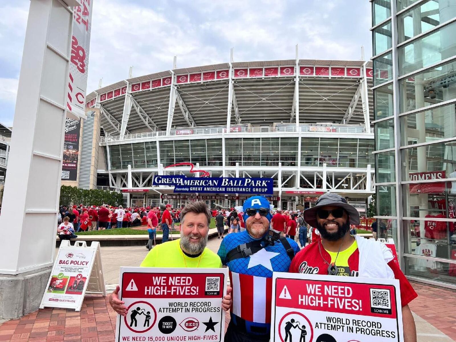 Jim Foliano, middle, worked with a lot of volunteers to set the world record for the most high-fives. CONTRIBUTED