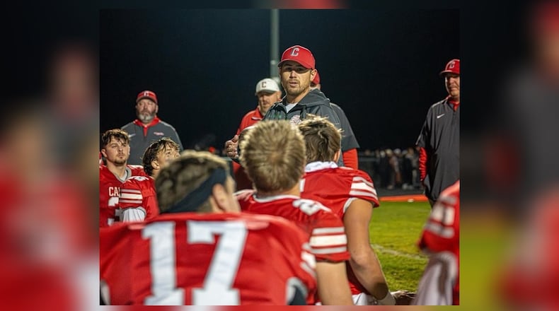 Carlisle football coach Josh Koogle talks with his team after a recent playoff victory. LAYTON HARTSOUGH / CONTRIBUTED