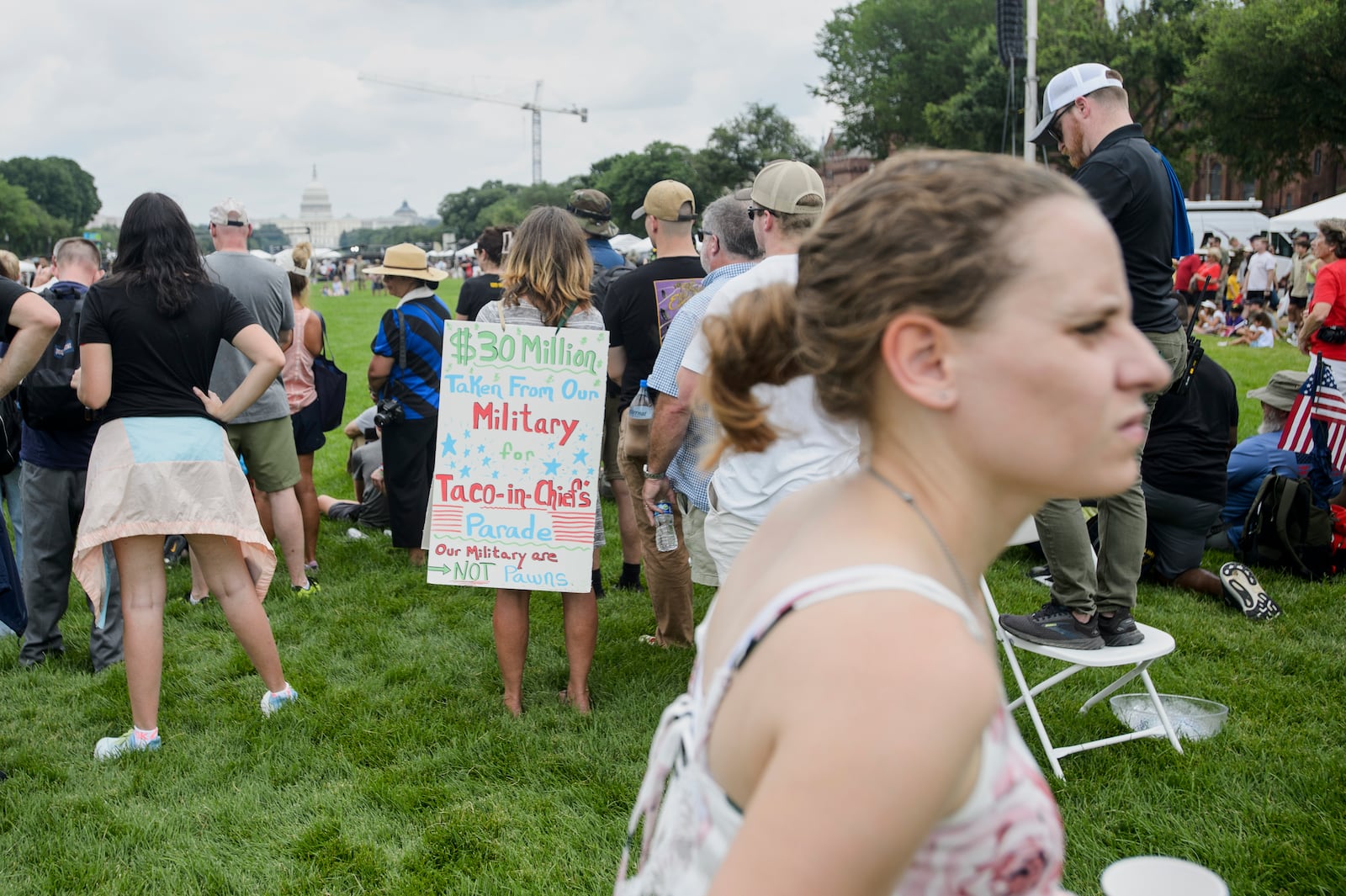 People watch a demonstration by the U.S. Army Drill Team during an event to honor the Army's 250th anniversary, coinciding with President Donald Trump's 79th birthday, Saturday, June 14, 2025, in Washington. (AP Photo/Rod Lamkey, Jr.)