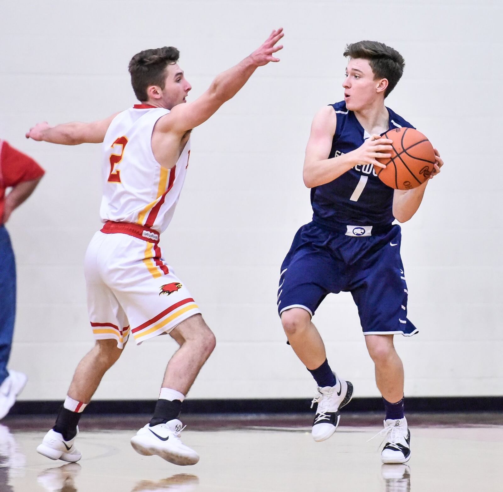 Edgewood’s Isaac Haskell looks to pass around Fenwick’s Jared Morris during Tuesday night’s game at Fenwick. NICK GRAHAM/STAFF