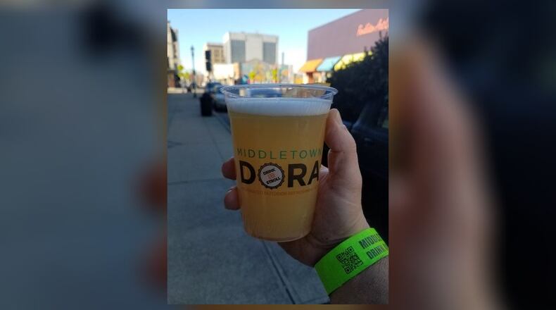Here’s what the new cup and wristband looks like that will be used in the Middletown Designated Outdoor Refreshment Area. The cups will begin being used on Jan. 4 and the wristbands will be mandatory starting Feb. 1. One side of the cup will have the Middletown DORA logo and the opposite side will have the DORA rules. The wristbands will cost $1 and is good all day in the Middletown DORA. CONTRIBUTED