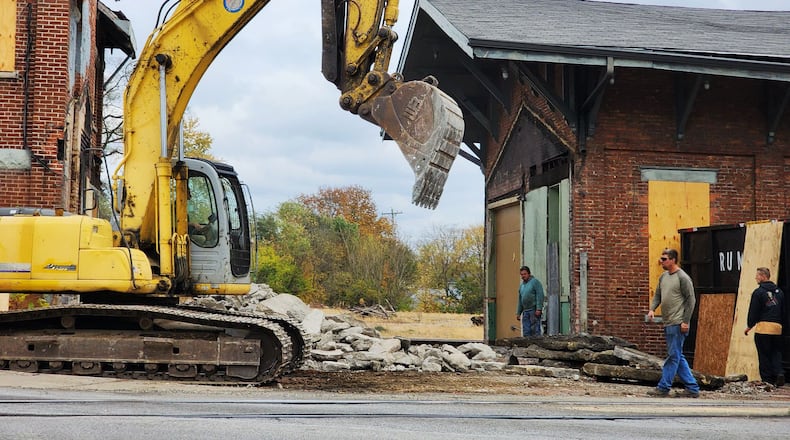 A connecting structure between a one-story and two-story buildings of the former CSX train depot on Martin Luther King Jr. Boulevard is being demolished on Oct. 31, 2022. The two primary buildings of the former train depot is be relocated about 1,000 feet north at the corner of Maple Avenue and Martin Luther King Jr. Boulevard. NICK GRAHAM/STAFF