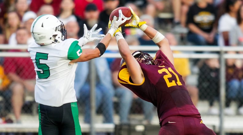Badin’s Marshall Flaig (5) knocks away a pass intended for Jackson Gifford of Ross during their season opener Aug. 24 at Robinson Field in Ross Township. Badin won 41-20. NICK GRAHAM/STAFF