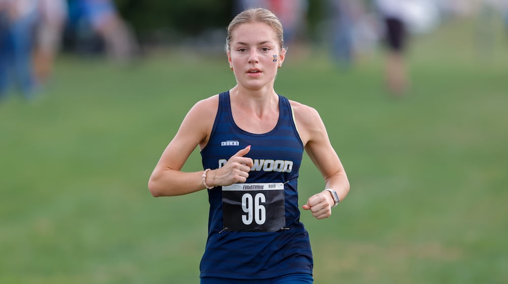 Oakwood High School senior Riley Meador competes in the Division III district cross country meet held Saturday, Oct. 18 at Cedarville University. MICHAEL COOPER / STAFF