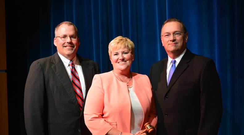 Talawanda Superintendent Kelly Spivey (middle) holds the gavel marking her installation as president of the Buckeye Association of School Administrators in August 2016. She is pictured with Talawanda school board vice president Michael Crowder (left) and Talawanda High School principal Tom York. CONTRIBUTED/BOB RATTERMAN