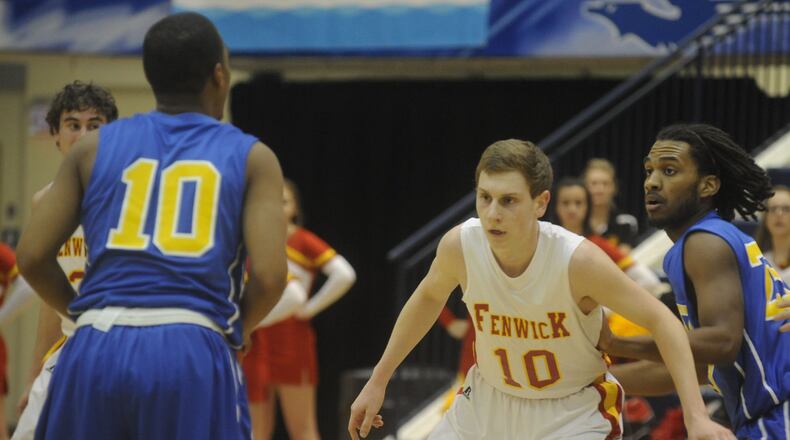 Fenwick’s Kevin Christie (10) defends Yancy Smith of Ponitz (10) during a Division II sectional game at Trent Arena in Fairmont on Feb. 25, 2014. MARC PENDLETON/STAFF