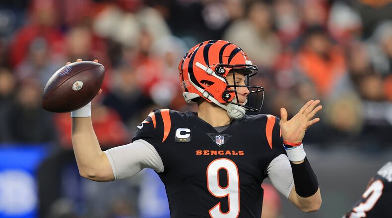 Cincinnati Bengals quarterback Joe Burrow (9) throws during the first half of an NFL football game against the San Francisco 49ers, Sunday, Dec. 12, 2021, in Cincinnati. (AP Photo/Aaron Doster)