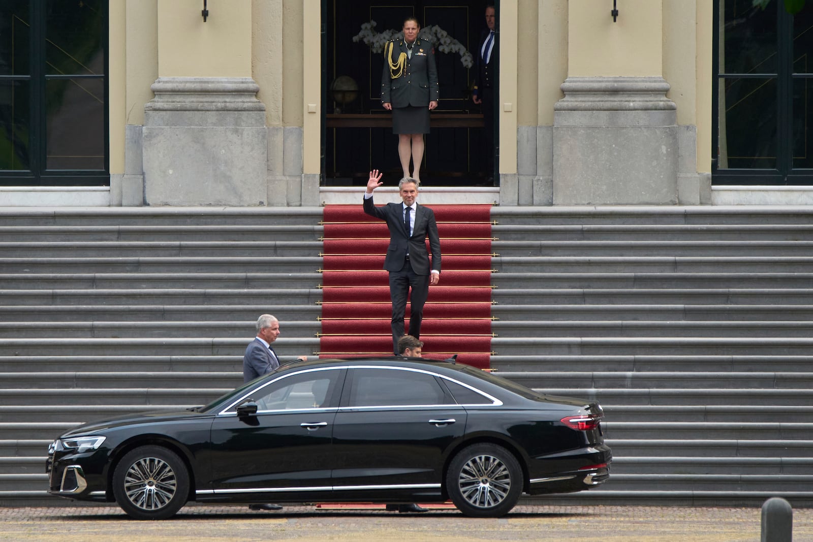 Dutch Prime Minister Dick Schoof waves after handing in the resignation of Geert Wilder's PVV party ministers to King Willem-Alexander at royal palace Huis ten Bosch in The Hague, Netherlands, Tuesday, June 3, 2025. (AP Photo/Peter Dejong)