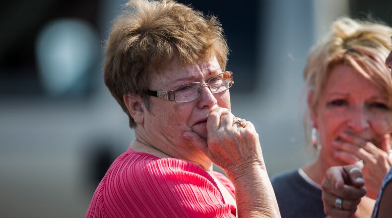 A woman reacts following a shooting at Townville Elementary in Townville Wednesday, Sept. 28, 2016. A teenager killed his father at his home Wednesday before going to the nearby elementary school and opening fire with a handgun, wounding two students and a teacher, authorities said. (Katie McLean/The Independent-Mail via AP)