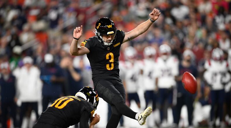 Washington Commanders kicker Cade York (3) kicks a field goal from the hold of Tress Way against the New England Patriots during the second half of a preseason NFL football game, Sunday, Aug. 25, 2024, in Landover, Md. (AP Photo/Nick Wass)