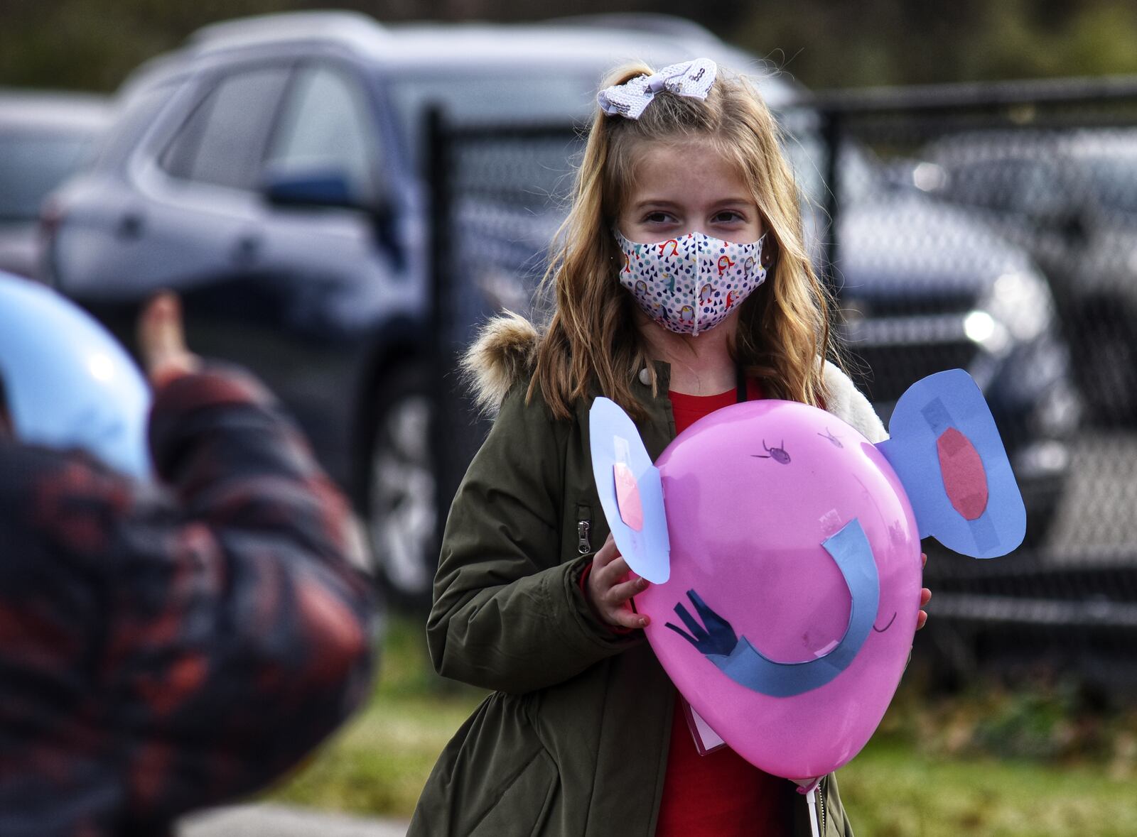 Everly Jackson, holding her elephant balloon, and other second graders at Fairfield South Elementary School decorated balloons for a parade outside for other students Tuesday, Nov. 24, 2030 on Bibury Road in Fairfield. NICK GRAHAM/ STAFF