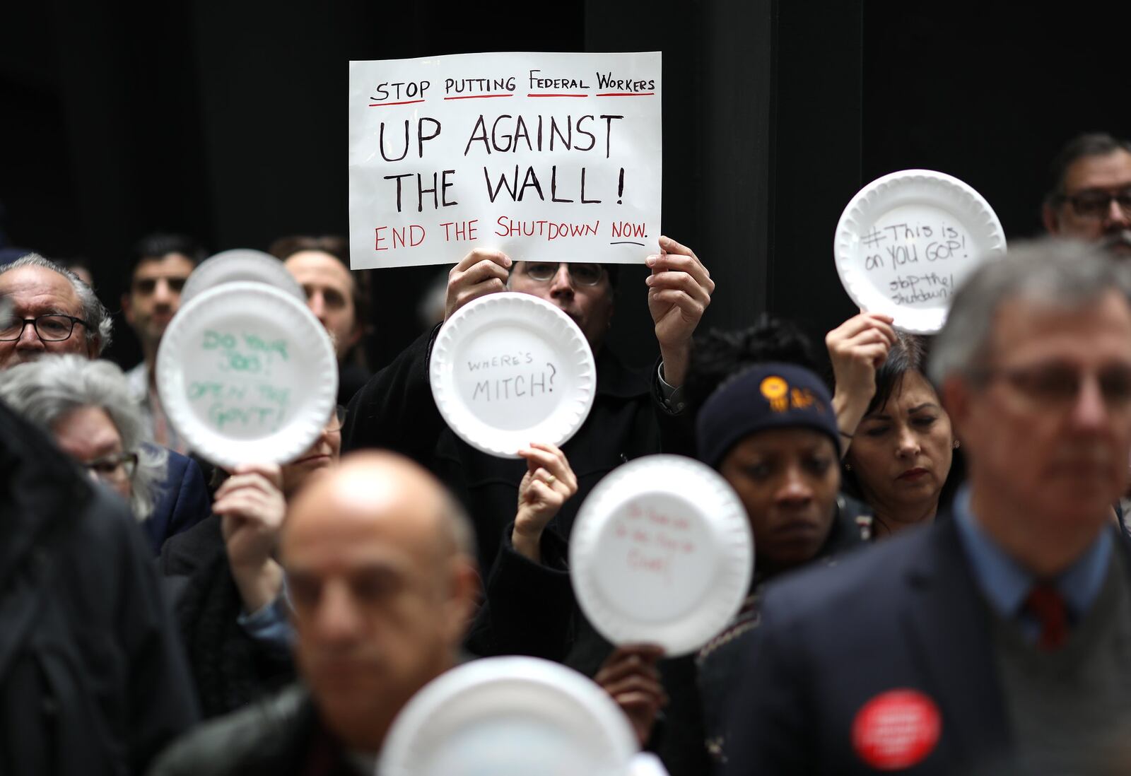 WASHINGTON, DC - JANUARY 23: Furloughed federal workers and those aligned with them protest the partial government shutdown in the Hart Senate Office Building January 23, 2019 in Washington, DC. Members of the National Federation of Federal Employees, the American Federation of Government Employees, the AFL-CIO, the Communications Workers of America, DC Jobs With Justice, International Federation of Professional & Technical Engineers and the Machinists Union sponsored an “Occupy Hart” protest on Capitol Hill against the partial government shutdown. (Photo by Win McNamee/Getty Images)